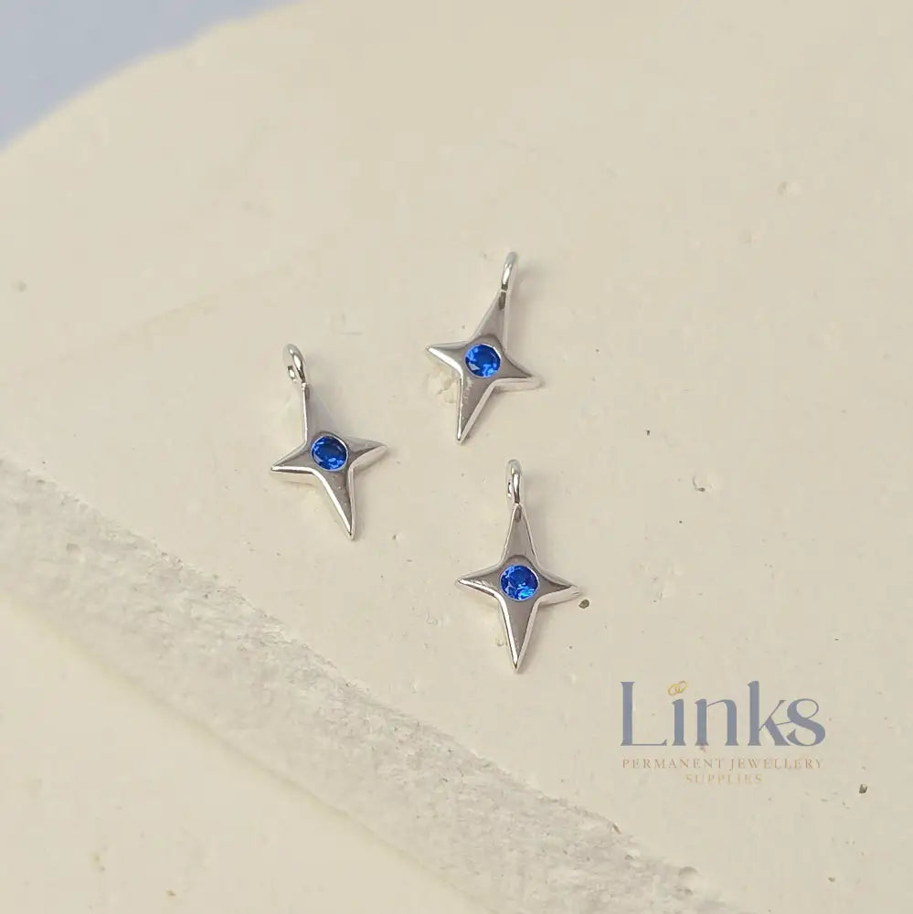 Sterling Silver 4 Pointed Star Charm with Blue CZ