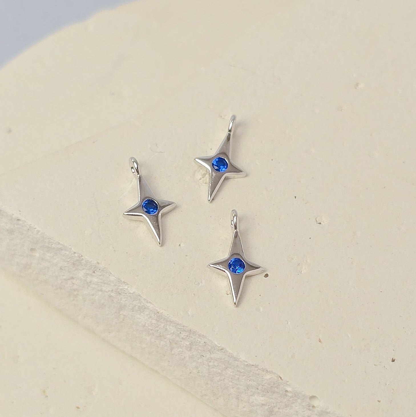 Sterling Silver 4 Pointed Star Charm with Blue CZ