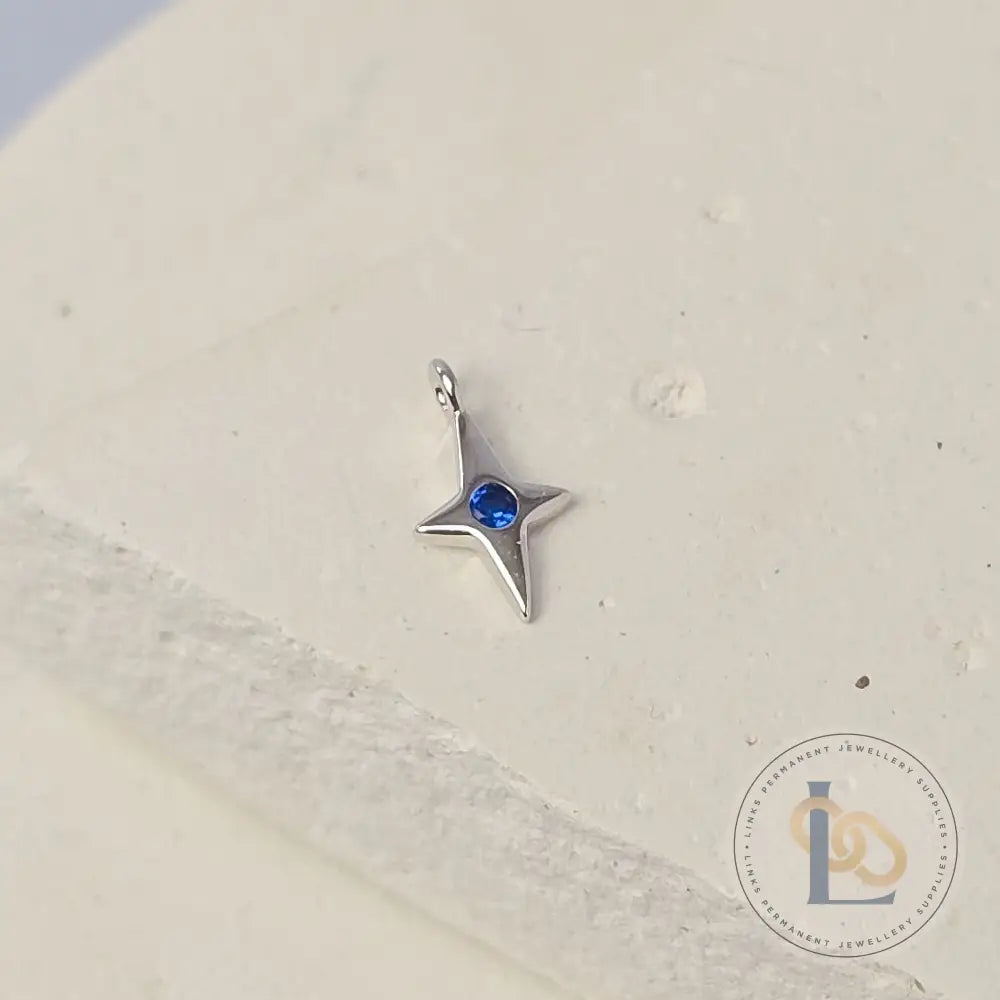 Sterling Silver 4 Pointed Star Charm with Blue CZ
