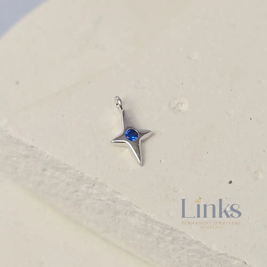 Sterling Silver 4 Pointed Star Charm with Blue CZ